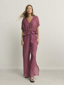 Nöista Top y pantalones holgados con cuello en V, mangas abullonadas, cintura con volantes escalonados y cordones. Casual, elegante y cómodo, perfecto para vacaciones en la playa y atuendos de aeropuerto