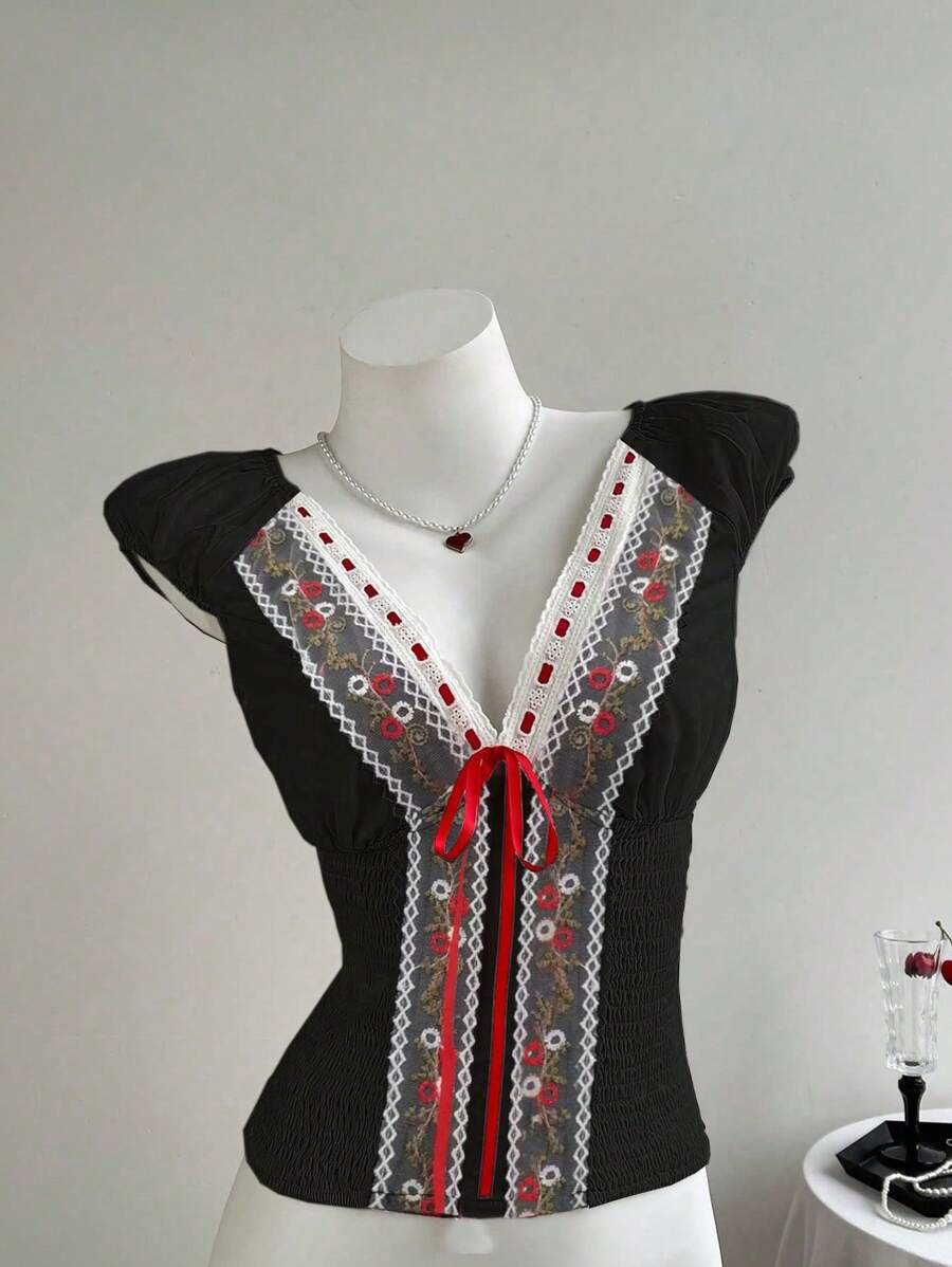 Elamini Blusa de mujer de manga corta con fruncido, bordado y lazo en la parte delantera, fresca y elegante, para primavera/verano - Negro - Ver 1