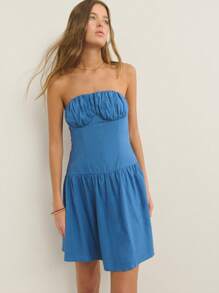 Nöista Fitted Strapless Silhouette Textured Knit Fabric With Ruched Bust And Flared Skirt; Lightweight Breathable Design; Perfect Beach Outfits For Women And Casual Pride Celebration Looks; Versatile Airport Outfit; Summer Essential.