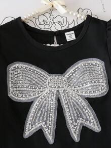 Vestido negro de manga corta con pliegues y decoración de flor blanca, cómodo para primavera/verano para niñas. Vestido negro para niñas, vestido con lazo para niñas, vestido con pliegues para niñas, vestido con rhinestones para niñas, ropa escolar - Negro - Ver 4