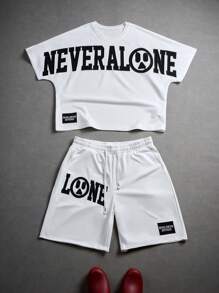 Manfinity EMRG Sommer Herren Jungs Sport Streetwear Set bestehend aus T-Shirt mit besticktem Buchstabenmotiv und Shorts