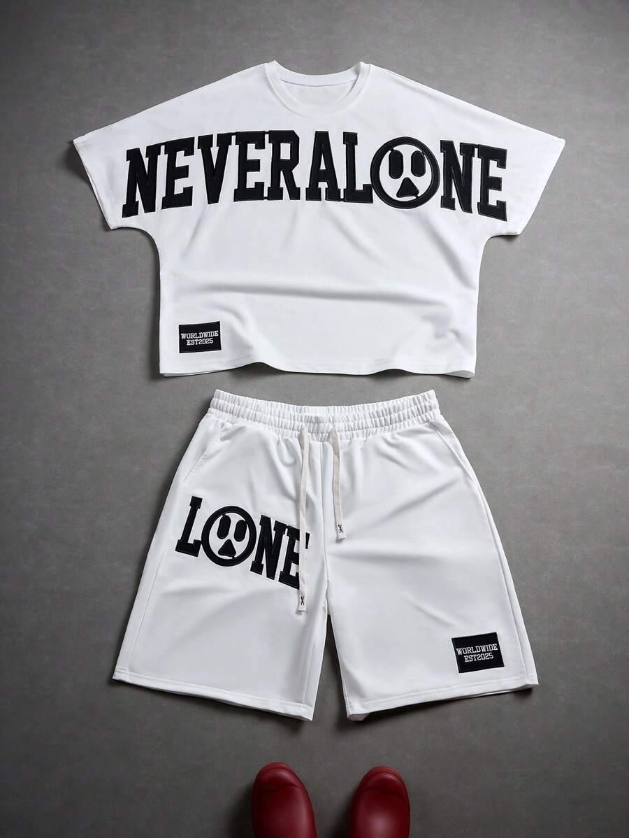 Manfinity EMRG Sommer Herren Jungs Sport Streetwear Set bestehend aus T-Shirt mit besticktem Buchstabenmotiv und Shorts