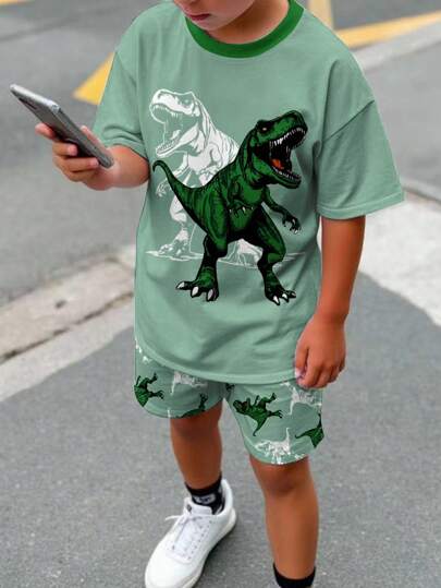 SHEIN 2pcs/Set Tween Boy Casual Simple Classic Cool Cartoon Tyrannosaurus Rex Graphic Printed Short Sleeve Round Neck T-Shirt And Shorts Set, For Summer Boys Dinosaur Clothes Boys Dinosaur Outfit Set Little Boys Dinosaur Short Set Boys Green Short Set Toddler Boy Summer Outfit