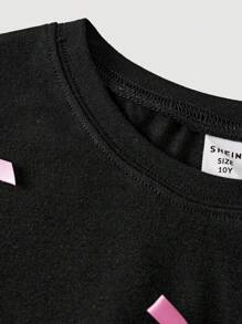 Conjunto de 2 peças de camiseta e shorts de ciclismo skinny com estampa de laço contrastante para meninas adolescentes, para a volta às aulas e cheio de estilo para meninas