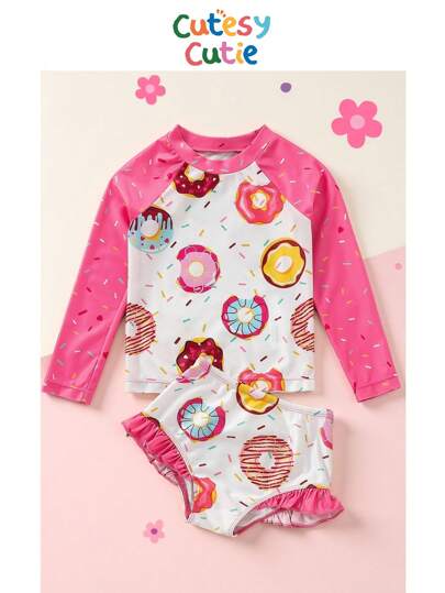 SHEIN Young Girl Casual Donut Printed Knitted Round Neck Long Sleeve Top And Triangle Swimwear Set