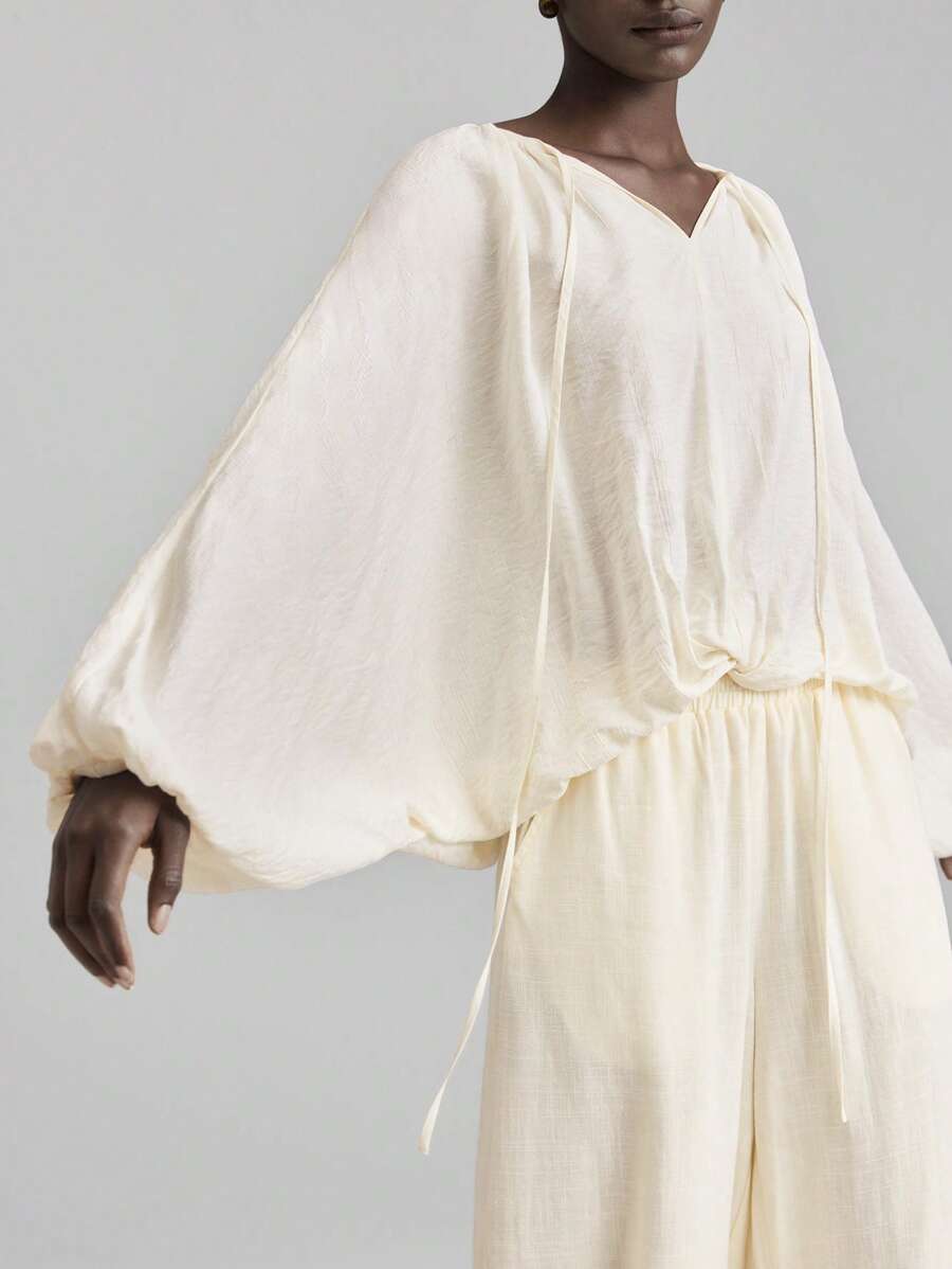 Ontre Áo thun nữ giáo viên thiết kế mới 2025 Ngày Độc lập, mặc thường ngày tại sân bay, chất liệu vải lanh thoải mái, cổ tròn, tay dài, thiết kế thắt nút, thắt eo, bo thun, dáng rộng, mặc hàng ngày, xuân/hè