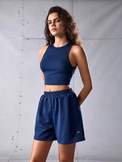 SHEIN Sports Conjunto deportivo de top corto y shorts de unicolor con cuello redondo para mujer