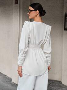 CLARA VERO Blusa con manga larga, cuello asimétrico, cintura recogida y puño largo