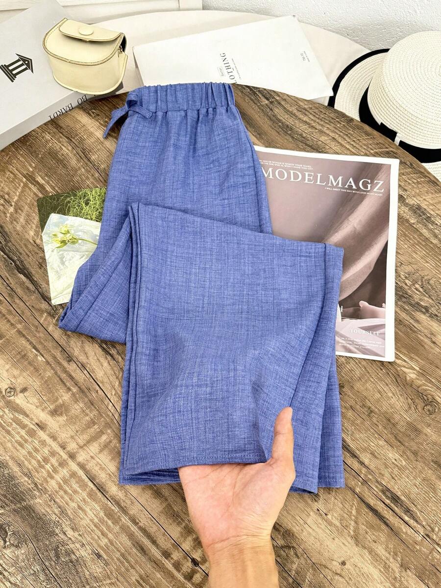SHEIN Pantalones azules sueltos y texturizados de uso informal para niñas preadolescentes, para la temporada de vuelta al colegio - Azul - Ver 1