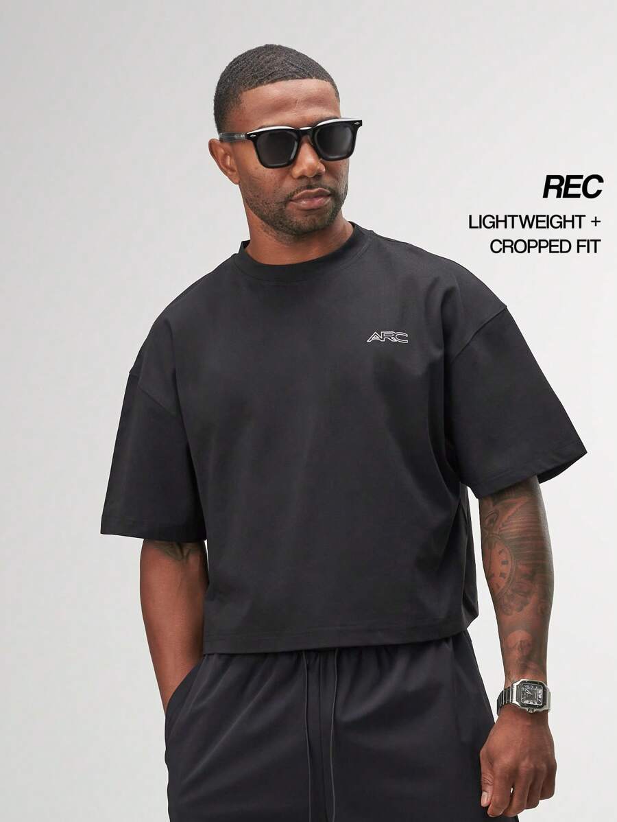 Camiseta holgada de rendimiento para gimnasio y entrenamiento de ARC Activewear - Negro - Ver 1