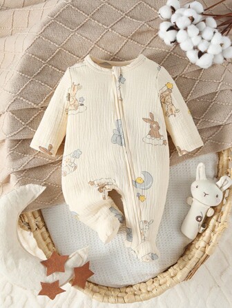 Aprikosfärgad jumpsuit med fot och tecknat grafiskt mönster för nyfödd baby, hemmakläder