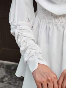 CLARA VERO Blusa con manga larga, cuello asimétrico, cintura recogida y puño largo