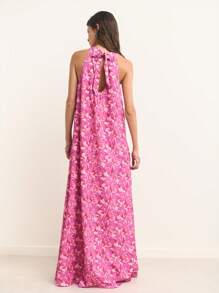Nöista Sleeveless Halter-Neck Maxi Dress In Magenta With Soft Pink Floral Print. Lightweight, Breathable Chiffon Fabric. A-Line Silhouette With Flowing Drape. Feminine, Elegant, Romantic, Airy, Stylish, Comfortable, Summer-Ready, Versatile, Chic, Flattering. - Purple - View 2