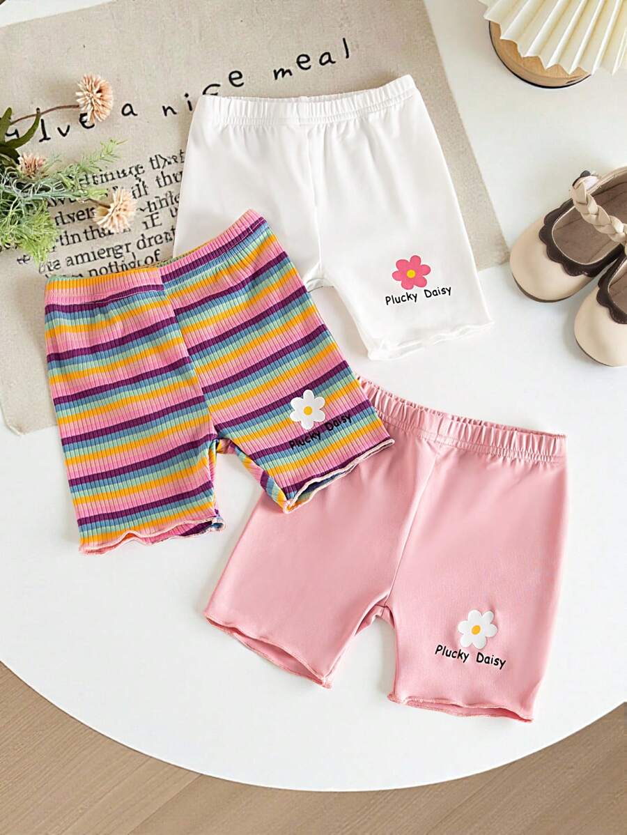 女婴三件套短裤，彩色条纹和花卉图案。春夏新品现已上市。舒适时尚、可爱休闲简约的风格，是日常穿着的必备单品。