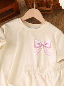 SHEIN Vintage Cute Bow Print, Pink Bow Design, Tween Girl Casual Minimalist Short Sleeve Shorts 2pcs Set, Suitable For Summer