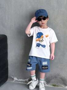SHEIN 2pcs/Set Young Boy Funny Graphic Print Top And Distressed Shorts. The Pattern Is Fun And Lively, With Excellent Denim Washing Technique. The Stylish Design And Comfortable Crew Neck T-Shirt Make It Suitable For Summer. The Simple And Fashionable Design Showcases The Personalized Of Boys Aged 4-7 For Casual Daily Wear.
