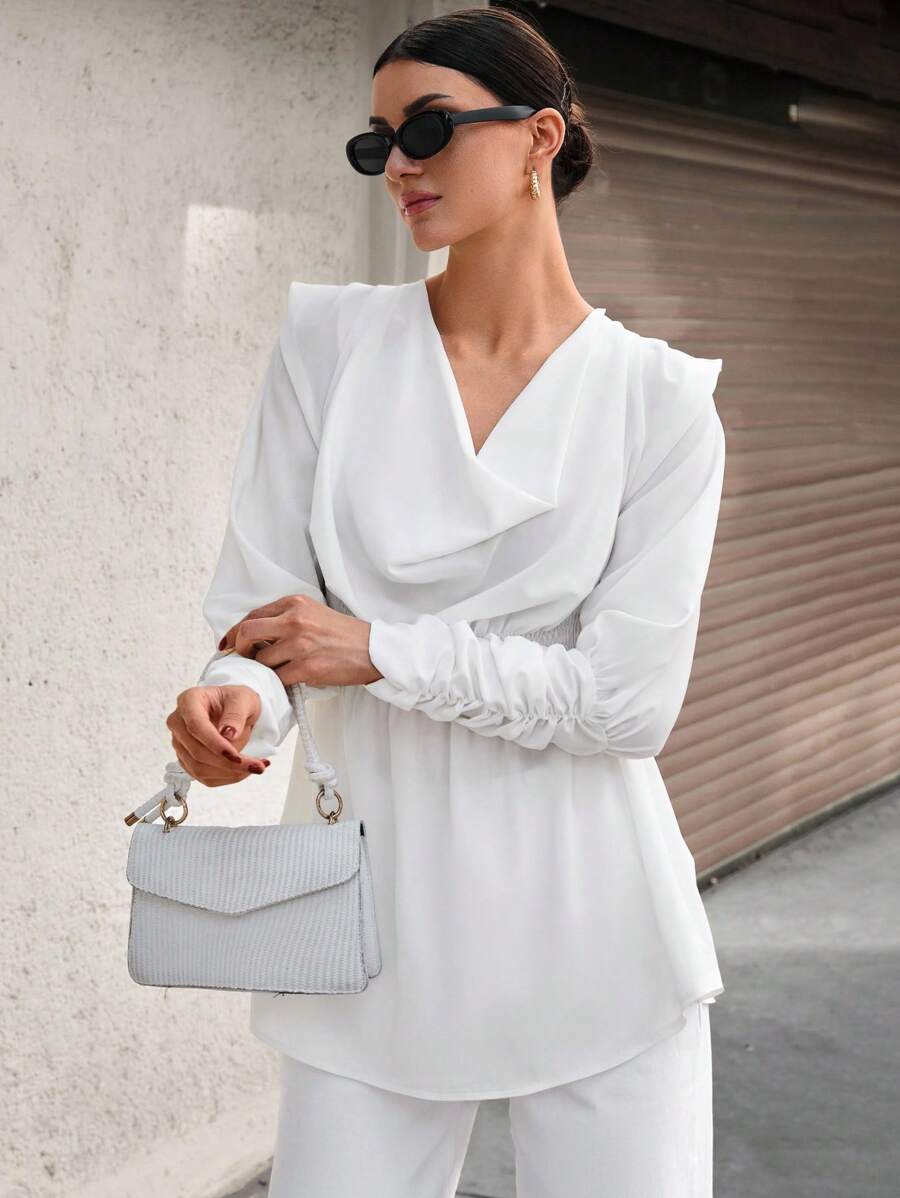 CLARA VERO Blusa con manga larga, cuello asimétrico, cintura recogida y puño largo