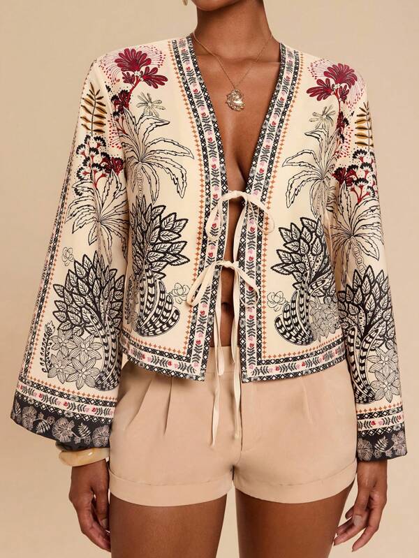 Travachic Blusa boho com decote em V, mangas flare, detalhe de nó e estampa floral completa. Adequada para férias, chá da tarde, temporada de casamentos, férias em cruzeiros na praia, férias em viagens de carro pela cidade, férias boho, festivais de música, moda praia, Páscoa, praia para mulheres, tops elegantes para mulheres, férias para mulheres, shows para mulheres, férias tropicais para mulheres, férias, boêmio, para primavera, verão e outono.