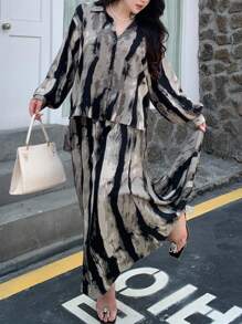 Dazy Plus Conjunto de 2 piezas de blusa holgada con estampado floral y falda para talla grande, estilo casual de resort para otoño/invierno