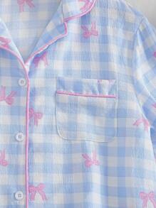 少女睡衣套装，时尚优雅的浅蓝色格子印花，搭配粉色蝴蝶结、荷叶边短袖上衣和长裤家居服两件套浅蓝色睡衣套装格子睡衣套装返校时尚