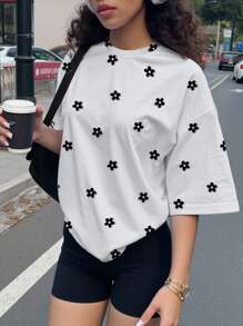 SHEIN Conjunto de 2 piezas para adolescentes con camiseta holgada de manga corta y estampado floral minimalista en blanco y negro, y leggings, apropiado para el verano