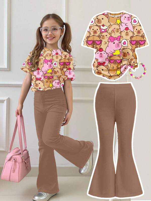SHEIN Set de 2 piezas de top de manga corta con cuello redondo y pantalón acampanado con estampado de dibujos animados para niña, casual de verano
