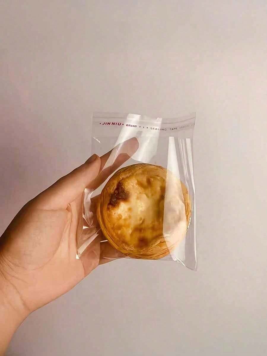 SHEIN 100pcs Simple Transparent OPP Bags - Suitable For Bread, Pastry, Tarts, Cookies And Desserts - Food Contact - Great For Christmas, Thanksgiving, Valentine's Day, Eid, Mother's Day And More - Essential For Kitchen And Bakery - Clear - View 1