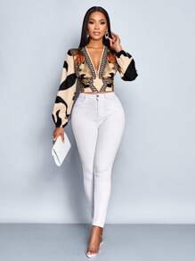 SOLERSUN Autumn/Winter Women's Wear. Casual And Elegant For Everyday Wear. Apricot-Colored Background With Black Floral Print. Woven Fabric. Deep V-Neck. Pleated Waist. Gathered Back. Long Sleeves. Lantern Sleeves. Shirt.