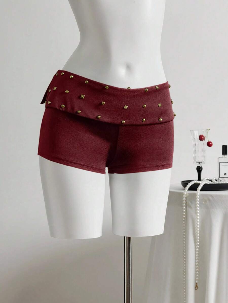Elamini Minifalda short asimétrica de cintura baja con diseño de remaches - Óxido marrón - Ver 1