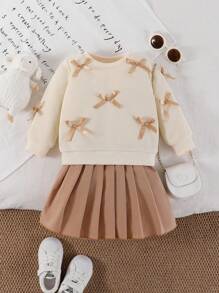 SHEIN Playful Pals 女婴两件套休闲甜美风格，黄色长袖运动衫搭配桃色蝴蝶结装饰和浅棕色百褶裙，适合日常穿着、上学、拍照、聚会、春秋季 - 杏色 - 查看 4