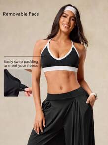 OutZeal Sujetador deportivo sin espalda con tiras cruzadas, almohadillas extraíbles y tela suave y transpirable para mujer, para uso urbano y casual - Negro - Ver 3