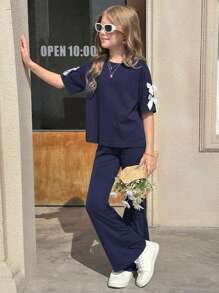 Set de 2 piezas de niña preadolescente: Camiseta de manga corta suelta con lazo decorativo y pantalones acampanados, versátil y casual, adecuado para el verano y el regreso a la escuela - Negro - Ver 10