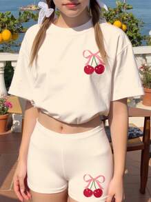 SHEIN 2 件套青少年女孩休闲可爱粉色蝴蝶结和樱桃印花短袖 T 恤和宽松短裤，适合夏季度假和旅行