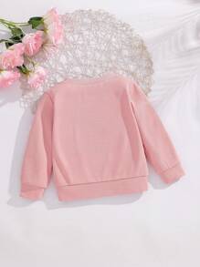 SHEIN Effen sweatshirt met ronde hals en strik voor babymeisjes. Het ronde halsontwerp is klassiek en elegant, waardoor het gemakkelijk aan en uit te trekken is. De lange mouwen en de decoratieve 3D-strik op het lijfje combineren vakkundig de schattige en modieuze elementen, waardoor de levendigheid en speelsheid van het meisje worden benadrukt. Het getailleerde silhouet en de vloeiende lijnen flatteren het figuur van de baby en stralen zelfvertrouwen en geluk uit. Dit sweatshirt is geschikt voor diverse gelegenheden.