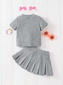 SHEIN Conjunto de 2 piezas de camiseta de manga corta de cuello redondo cómoda y casual para niña con decoración de lazo 3D y falda, adecuado para la escuela, vuelta al colegio, uso diario casual y deportes - Gris - Ver 3