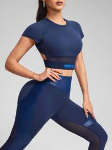 Innovista Woman Color Block Contrast Stitching Shiny Foil Glossy Metallic Activewear Sports Sets Sophisticated Two Tone Letter Tape Design Workout Clothes Athletic Outfits Training Breathable Active Crop Top T-Shirt With Booty Lifting Leggings Phone Bottom Two Pieces Daily Yoga Cycle Biker HIIT Office To Court Brunch To Gym Two Pieces Multi Function Athleisure All Day