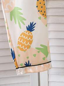 Conjunto de chaqueta tipo cárdigan y pantalón largo casual con estampado todo sobre piña, look minimalista y fresco para niñas preadolescentes