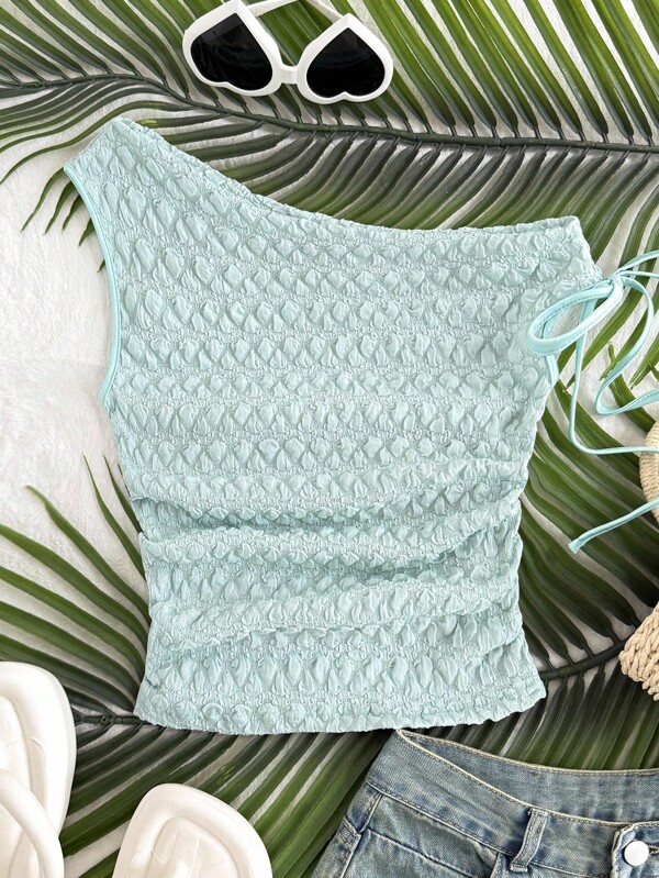 Parte superior de punto con textura para niña preadolescente con cuello asimétrico y decoración de lazo