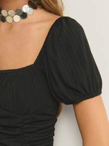 Nöista Romantic Bkack In This Ruched Black Midi Dress. With Puff Sleeves And A Flattering Gathered Bodice, It's Perfect For Sunset Dinners Or A Night Of Dancing. A Timeless Pick With Modern Flair.