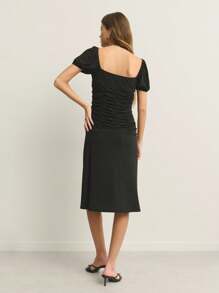 Nöista Romantic Bkack In This Ruched Black Midi Dress. With Puff Sleeves And A Flattering Gathered Bodice, It's Perfect For Sunset Dinners Or A Night Of Dancing. A Timeless Pick With Modern Flair.