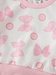 SHEIN 这款女宝宝时尚、可爱、甜美、活泼、俏皮、优雅，粉色蝴蝶结，波点圆领，长袖拼接，黑色菌褶边上衣和黑色菌褶边装饰，搭配喇叭长裤，适合日常居家外出、购物、运动、校园露营、野餐等秋冬季穿着。 - 粉色 - 查看 4