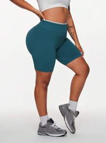 SHEIN Rhythm Era Shorts deportivos sin costuras y que realzan la figura para mujeres de talla grande - Verde Oliva - Ver 4