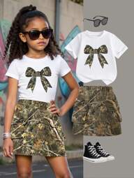 SHEIN Young Girl Casual Minimalist Bow Decor Short Sleeve Round Neck T-Shirt With Utility Skirt, Suitable For Summer