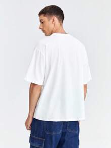 Manfinity VCAY Camiseta de manga corta casual de punto holgada con estampado de dinosaurio para hombres, adecuada para uso diario en verano