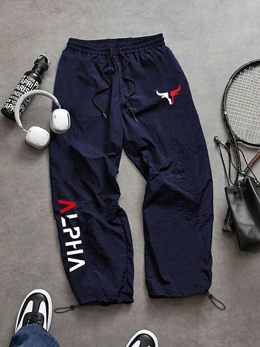 Manfinity Sport Corelite Pantalones largos informales de hombre con cintura elástica con cordón y estampado