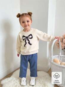 SHEIN Baby Girl 2 Pieces Set,Apricot White Round Neck Long Sleeve Sweatshirt,Graphic Black Bow Print,Blue Denim Pants,Cute Autumn Back-To-School Casual Wear - Apricot - View 1