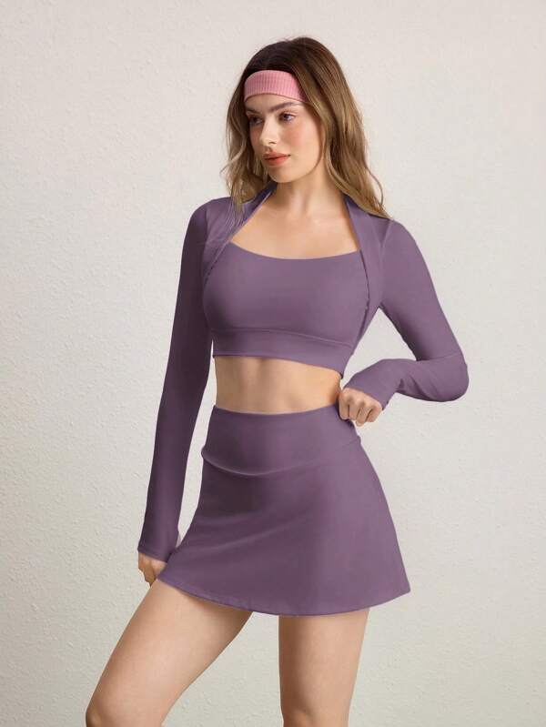 CourtClass Conjunto deportivo de mujer con camiseta corta de manga larga con cuello de cisne de unicolor y falda pantalón