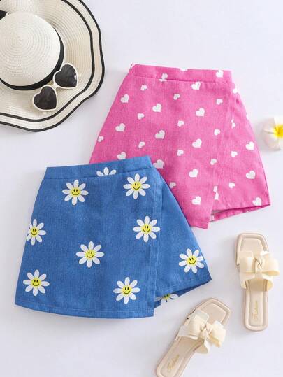 2 st/set flickor livliga semestershorts med solroshjärta och leende ansikte, denimtryck och asymmetriska fåll, blå och rosa kombination, lämpliga för sommarutflykter