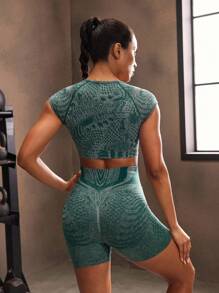 Powerista Damen Sport-Set mit rundem Ausschnitt, Raglanärmeln und Allover-Muster aus T-Shirt und Shorts
