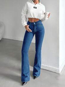 Jeans de algodón elástico con lavado oscuro y talle alto para mujer